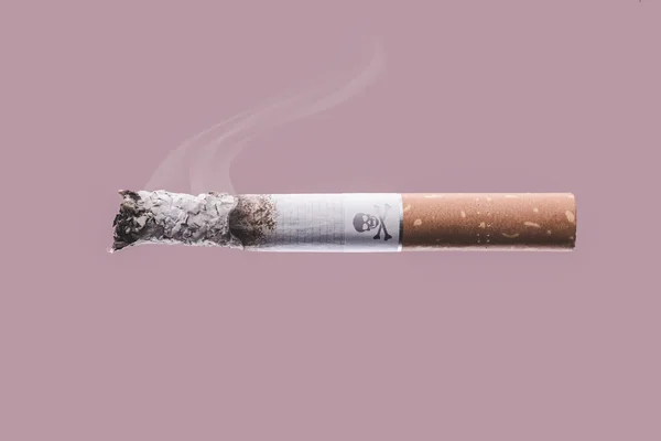 Cigarette  with skull and bones symbol — Stock Photo, Image