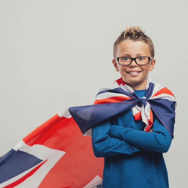 Superhero boy standing with crossed arms — Stockfoto
