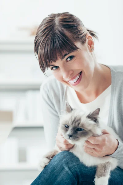 Woman caressing  cat Stock Picture