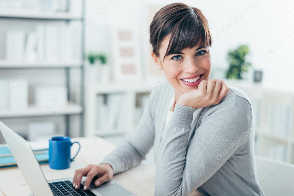 businesswoman sitting at office desk