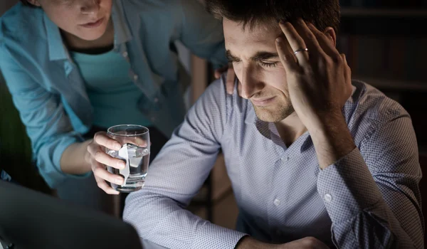 Wife comforting her depressed husband — Stock Photo, Image