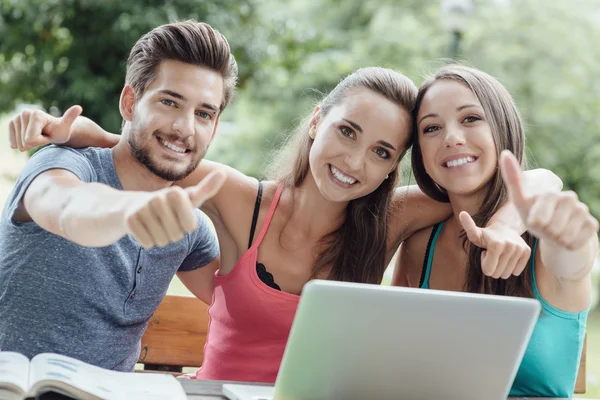 Man and  girls showing  thumbs up — Stock Photo, Image