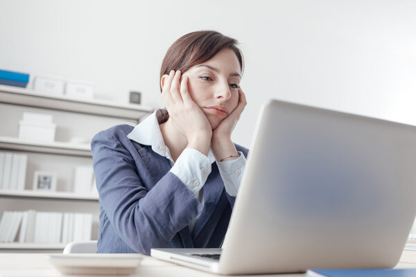 Bored businesswoman in her office