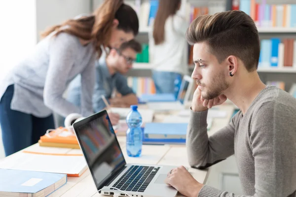 College students doing homework — Stock Photo, Image