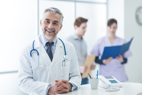 Confident doctor posing