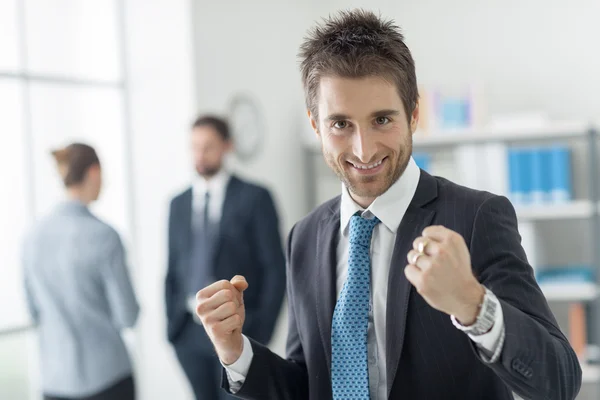 Cheerful businessman with raised fists — Stock Photo, Image