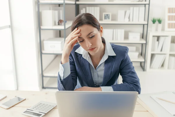 Exhausted businesswoman in the office Royalty Free Stock Images