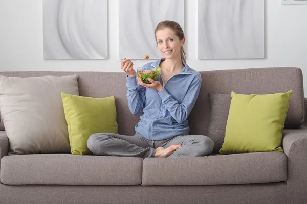 Young woman having lunch at home — Stock Photo, Image