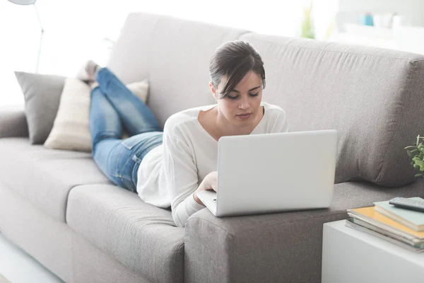Woman relaxing on the sofa — Stock Photo, Image