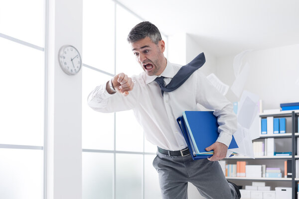 business man in a hurry checking time
