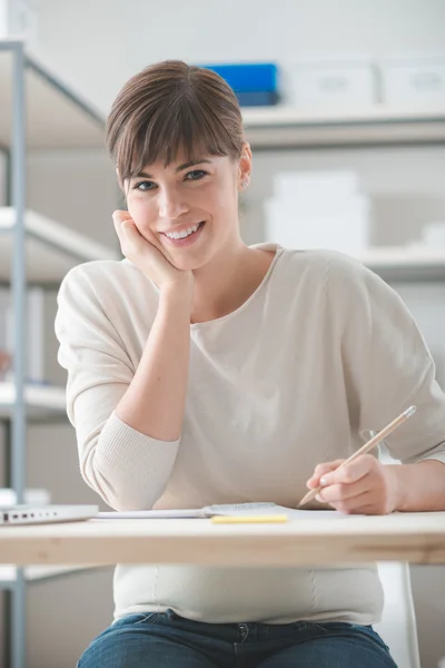 Young designer sketching on a notepad — Stock Photo, Image