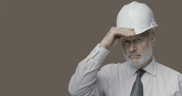 Confident Businessman Engineer Posing Looking Camera Adjusting His Safety Helmet — Stock Photo, Image