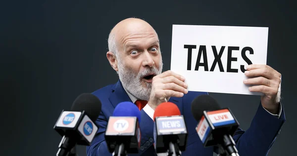 Aggressive Evil Politician Holding Sign Taxes Concept Press Coneference — Stock Photo, Image