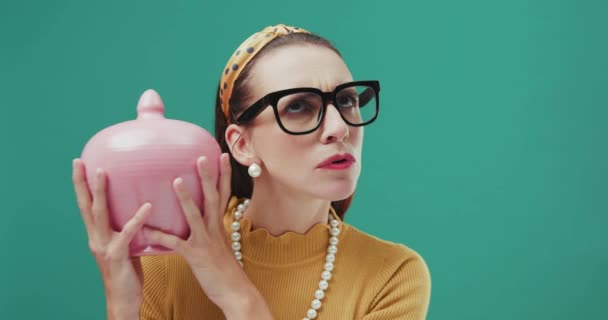 Funny woman shaking money box. — Stock Video