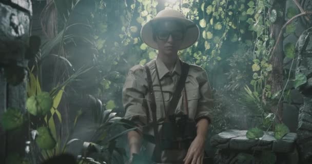 Scared explorer lost in the jungle — Stock Video
