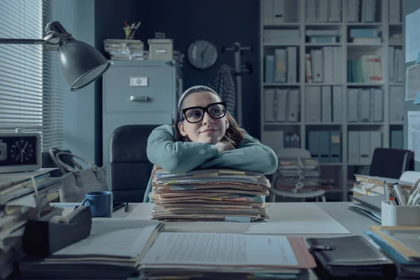 Lazy Office Worker Sitting Desk Leaning Pile Paperwork She Smiling — Stock Fotó