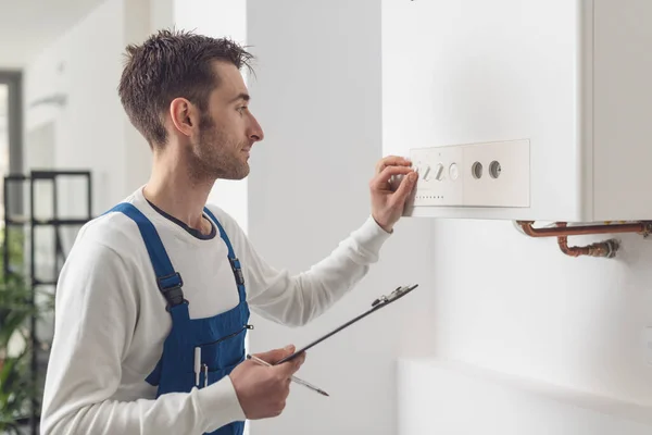 Professional Plumber Checking Boiler Control Panel Adjusting Knob — Stock Photo, Image