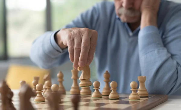 Senior Man Playing Chess Moving Piece Chessboard — Stock Photo, Image