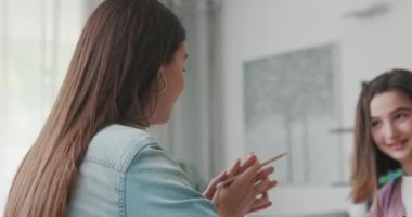 Woman helping children with their homework