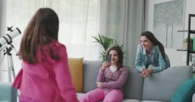Happy family recording videos at home