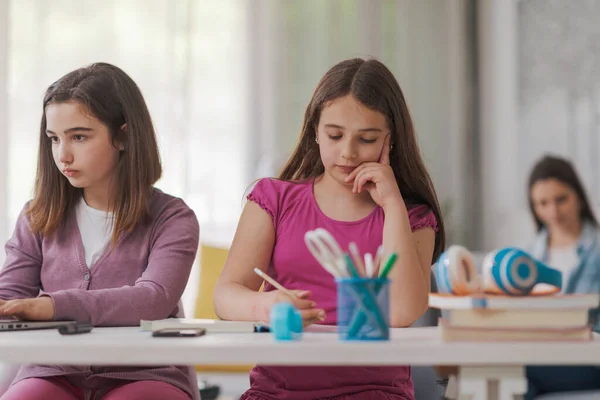 Cute Girls Sitting Desk Doing School Homework — 图库照片