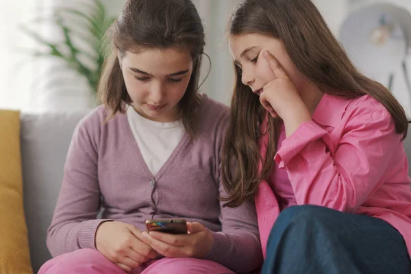 Cute Children Sitting Sofa Living Room Using Smartphone Together — Stock Fotó