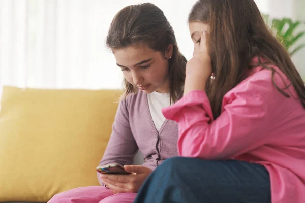 Cute Children Sitting Sofa Living Room Using Smartphone Together —  Fotos de Stock