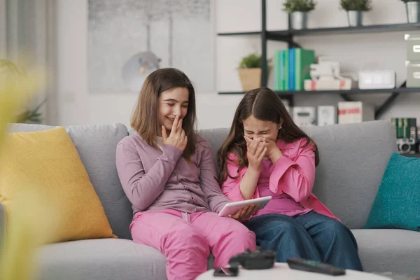 Happy Cheerful Girls Sitting Sofa Living Room Connecting Digital Tablet —  Fotos de Stock