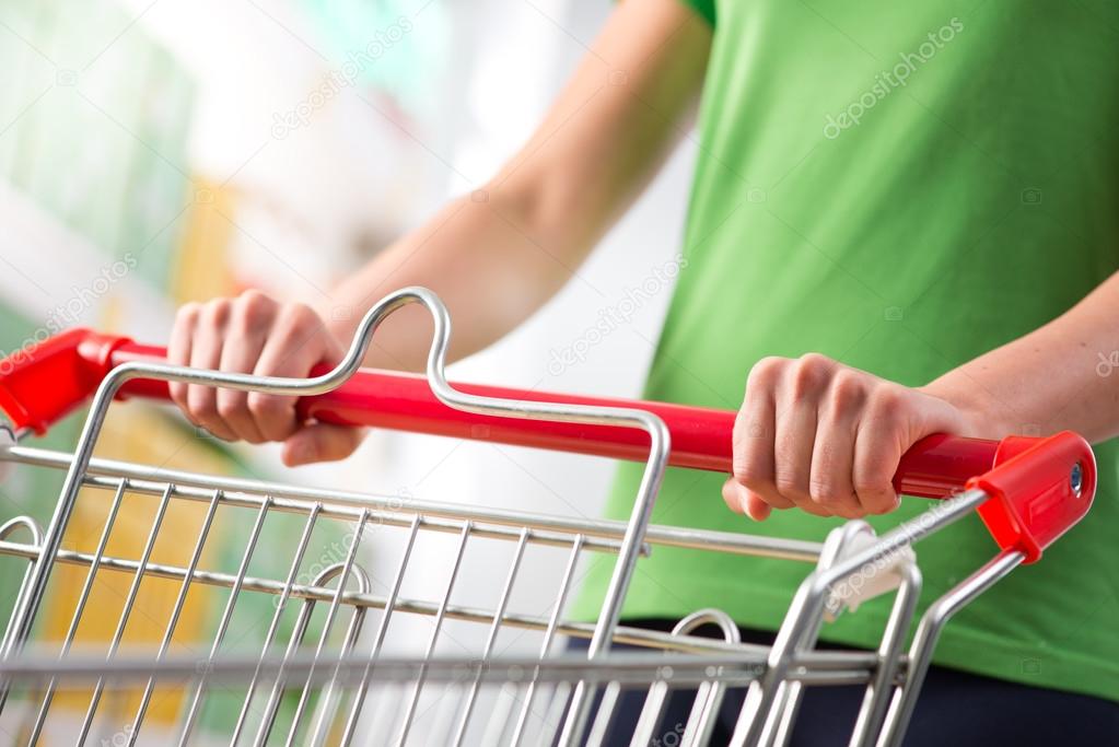 Woman with trolley at supermarket