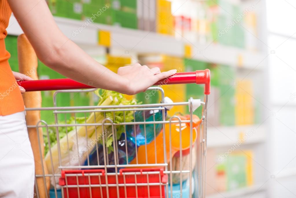 Woman at supermarket with trolley