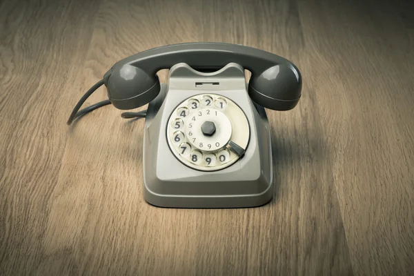 硬木表面上的老式电话 — 图库照片