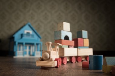 Wooden toy train and doll house clipart