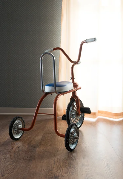 Vintage orange tricycle — Stock Photo, Image