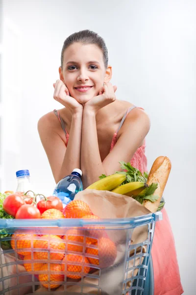 Woman shopping with hands on chin — Stock Photo, Image