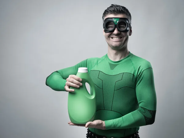 Superhero showing an eco-detergent for laundry — Stock Photo, Image