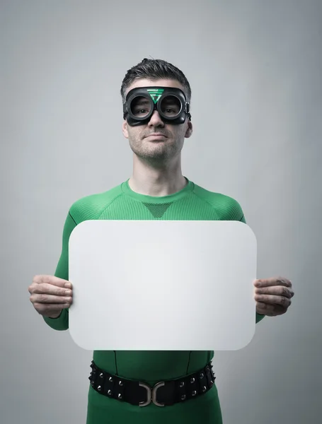 Superhero holding a blank sign — Stock Photo, Image