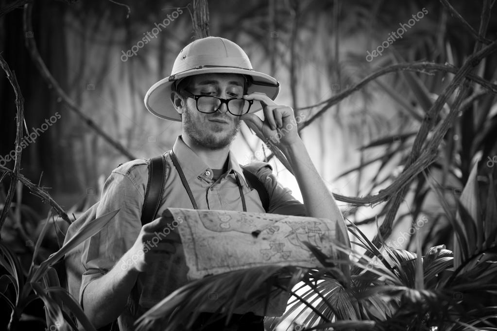 Explorer examining an old map — Stock Photo © stokkete #54955117