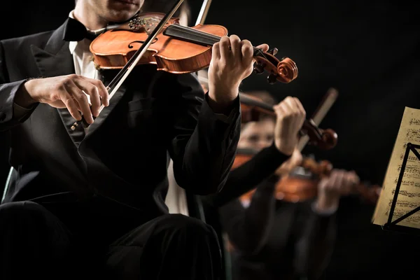 Violin orchestra performing — Stock Photo, Image