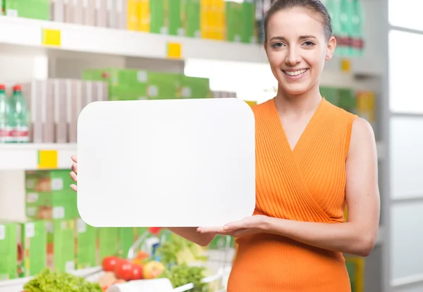 Woman holding blank sign — Stock Photo, Image