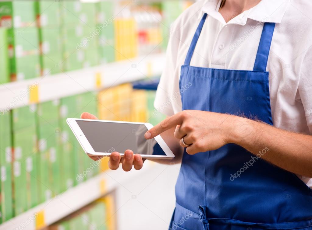 Sales clerk using tablet