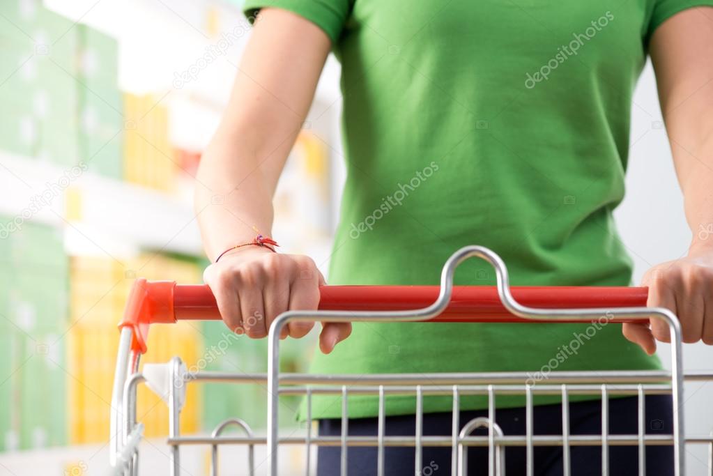 Woman pushing shopping cart