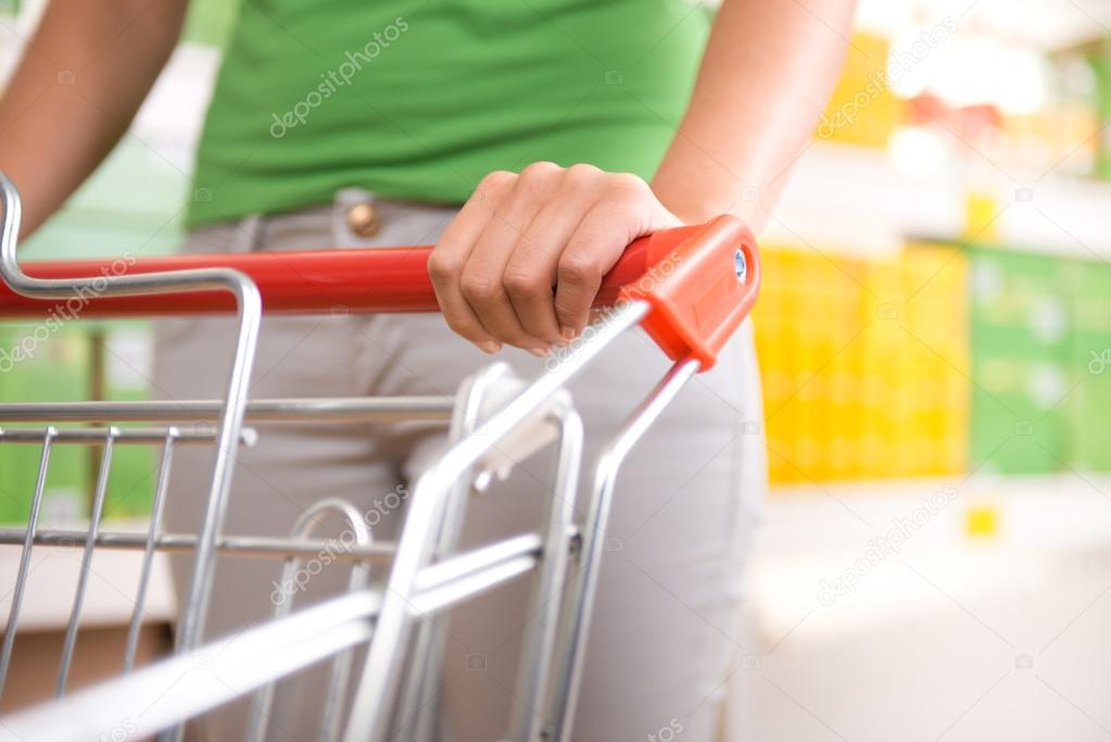 Woman pushing shopping cart