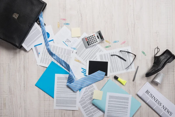 Briefcase with paperwork and accessories — Stock Photo, Image