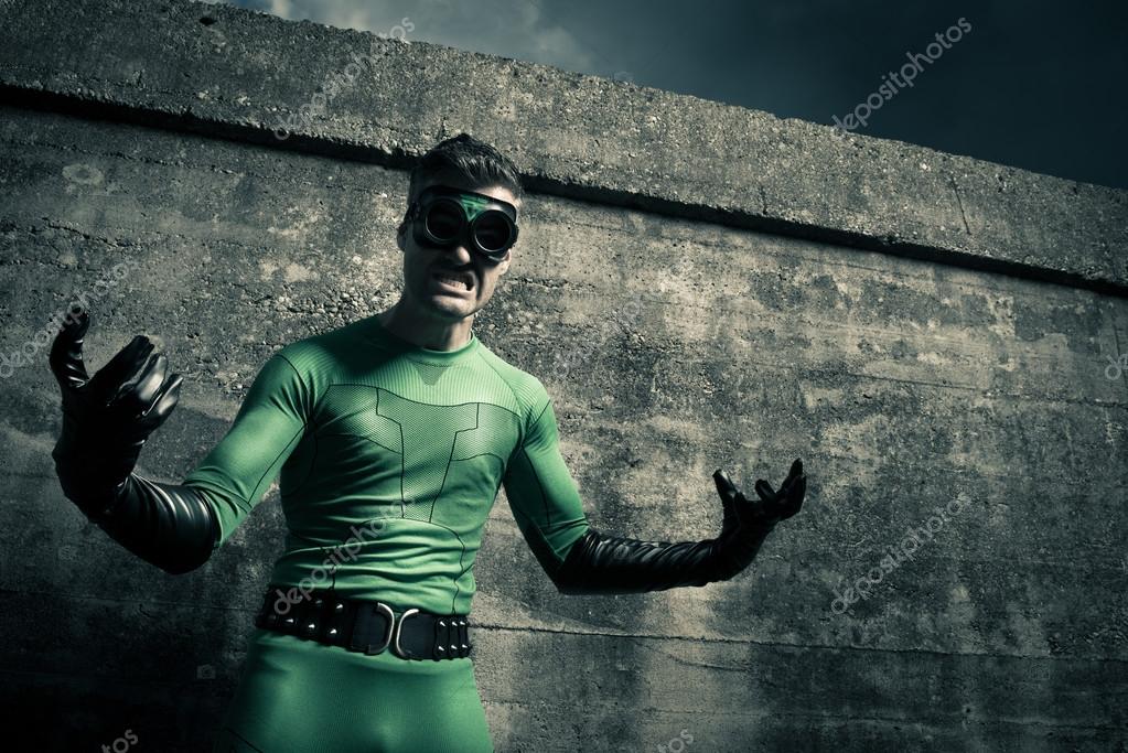 Aggressive superhero against a concrete wall — Stock Photo © stokkete 56588171