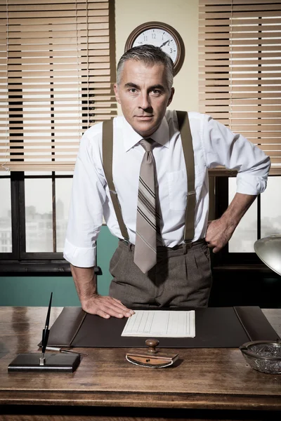 Businessman with arms akimbo — Stock Photo, Image