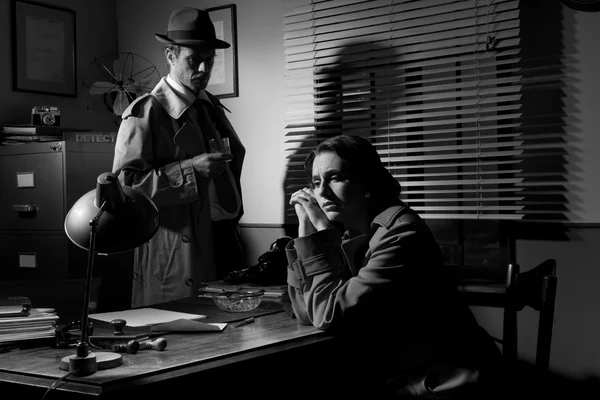 Detective interviewing a young pensive woman in his office — Stock Photo, Image