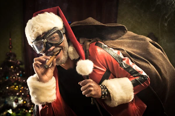 Bad Santa carrying sack with gifts — Stock Photo, Image