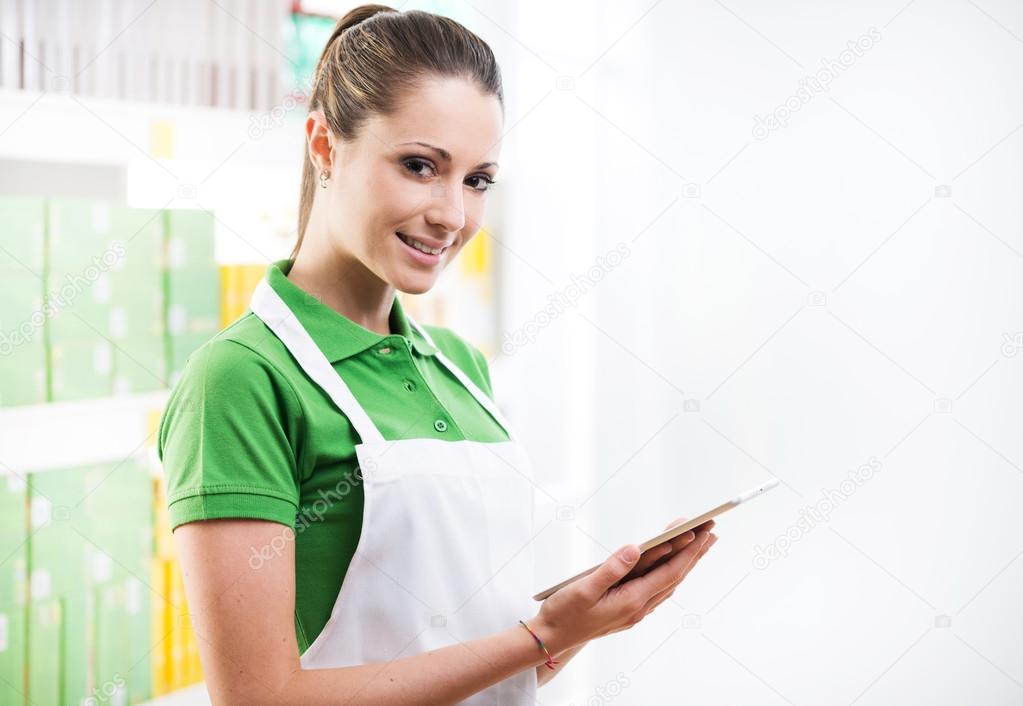 Sales clerk with digital tablet
