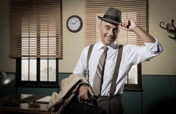 Smiling businessman leaving office