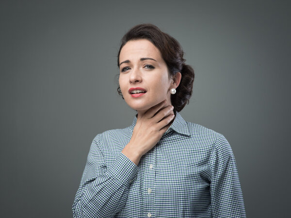 Woman with sore throat